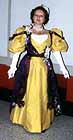 1896 ball dress, yellow silk doupionni, purple and gold feather brocade, worn by Jane